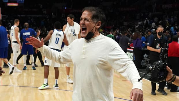 Nov 23, 2021; Los Angeles, California, USA; Dallas Mavericks owner Mark Cuban celebrates at the end of the game against the LA Clippers at Staples Center. The Mavericks defeated the Clippers 112-104 in overtime.Mandatory Credit: Kirby Lee-USA TODAY Sports