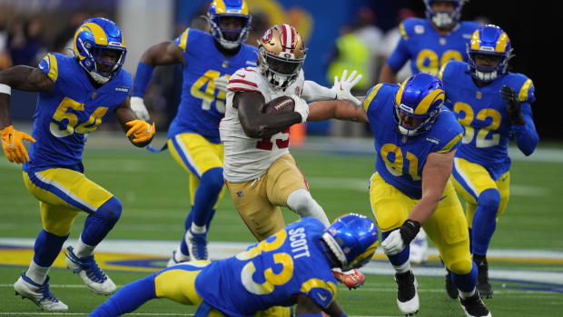 Jan 30, 2022; Inglewood, California, USA; San Francisco 49ers wide receiver Deebo Samuel (19) is pursued by Los Angeles Rams outside linebacker Leonard Floyd (54) and defensive end Earnest Brown IV (90) on a 44-yard touchdown reception in the second quarter during the NFC Championship game at SoFi Stadium. The Rams defeated the 49ers 20-17. Mandatory Credit: Kirby Lee-USA TODAY Sports