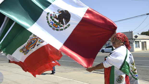 Agustin Marquez displays Mexican flags on sale for Mexican Independence Day. Shopownerfixesflag