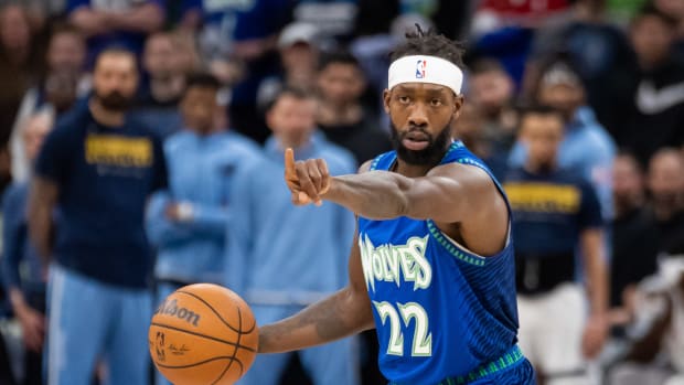 Apr 21, 2022; Minneapolis, Minnesota, USA; Minnesota Timberwolves guard Patrick Beverley (22) signals his team against the Memphis Grizzlies in the third quarter during game one of the three round for the 2022 NBA playoffs at Target Center. Mandatory Credit: Brad Rempel-USA TODAY Sports