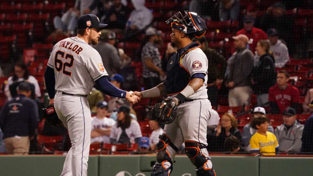 May 17, 2022; Boston, Massachusetts, USA; Houston Astros catcher Martin Maldonado (15) congratulates relief pitcher Blake Taylor (62) after defeating the Boston Red Sox in nine innings at Fenway Park. Mandatory Credit: David Butler II-USA TODAY Sports