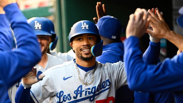 May 24, 2022; Washington, District of Columbia, USA; Los Angeles Dodgers right fielder Mookie Betts (50) is congratulated by teammates after hitting a three run home run against the Washington Nationals during the second inning at Nationals Park. Mandatory Credit: Brad Mills-USA TODAY Sports