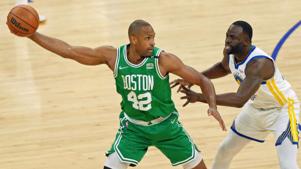 Jun 2, 2022; San Francisco, California, USA; Boston Celtics center Al Horford (42) controls the ball while defended by Golden State Warriors forward Draymond Green (23) during the first half of game one of the 2022 NBA Finals at Chase Center. Mandatory Credit: Darren Yamashita-USA TODAY Sports