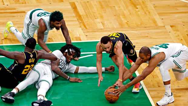 Jun 8, 2022; Boston, Massachusetts, USA; Golden State Warriors guard Stephen Curry (30) and forward Draymond Green (23) go for the ball against Boston Celtics center Al Horford (42), guard Marcus Smart (36) and center Robert Williams III (44) during the fourth quarter in game three of the 2022 NBA Finals at TD Garden. Mandatory Credit: Winslow Townson-USA TODAY Sports