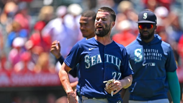 Jun 26, 2022; Anaheim, California, USA; Seattle Mariners right fielder Jesse Winker (27) yells at fans after a benches clearing brawl with the Los Angeles Angels in the second inning at Angel Stadium. Mandatory Credit: Jayne Kamin-Oncea-USA TODAY Sports