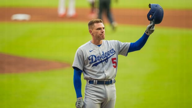 Jun 24, 2022; Cumberland, Georgia, USA; Los Angeles Dodgers first baseman Freddie Freeman (5) acknowledges the fans ovation as he steps to the plate against the Atlanta Braves during the first inning at Truist Park. Mandatory Credit: Dale Zanine-USA TODAY Sports