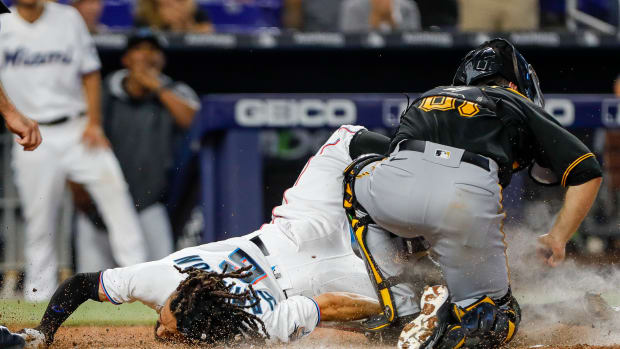 Jul 14, 2022; Miami, Florida, USA; Miami Marlins left fielder Billy Hamilton (6) slides onto home plate and scores a run during the fifth inning against the Pittsburgh Pirates at loanDepot Park. Mandatory Credit: Sam Navarro-USA TODAY Sports© Sam Navarro-USA TODAY Sports