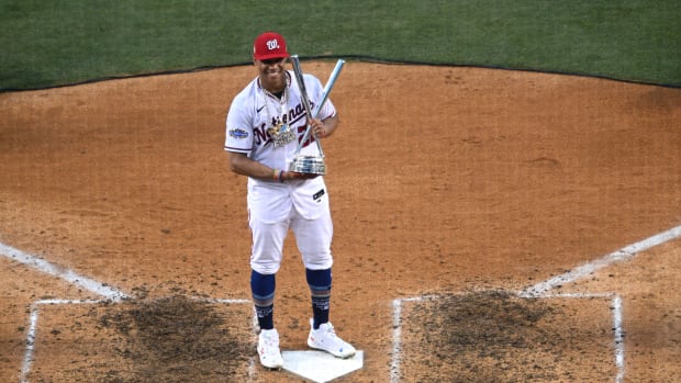 Jul 18, 2022; Los Angeles, CA, USA; Washington Nationals right fielder Juan Soto (22) celebrates with the trophy after winning the 2022 Home Run Derby at Dodgers Stadium. Mandatory Credit: Orlando Ramirez-USA TODAY Sports