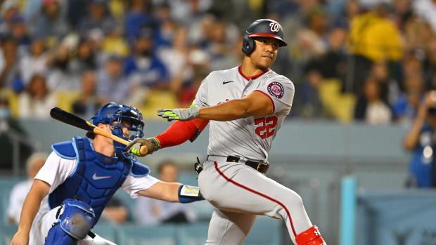 Jul 25, 2022; Los Angeles, California, USA; Washington Nationals right fielder Juan Soto (22) follows through on a two-RBI triple in the fifth inning against the Los Angeles Dodgers at Dodger Stadium. Mandatory Credit: Jayne Kamin-Oncea-USA TODAY Sports