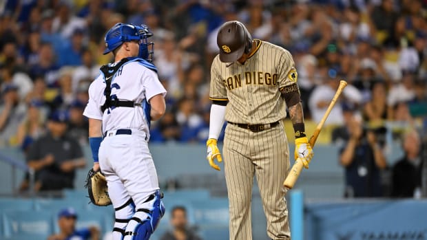 Aug 5, 2022; Los Angeles, California, USA; San Diego Padres third baseman Manny Machado (13) hangs his head after he was called out on strikes in the sixth inning against the Los Angeles Dodgers at Dodger Stadium. Mandatory Credit: Jayne Kamin-Oncea-USA TODAY Sports