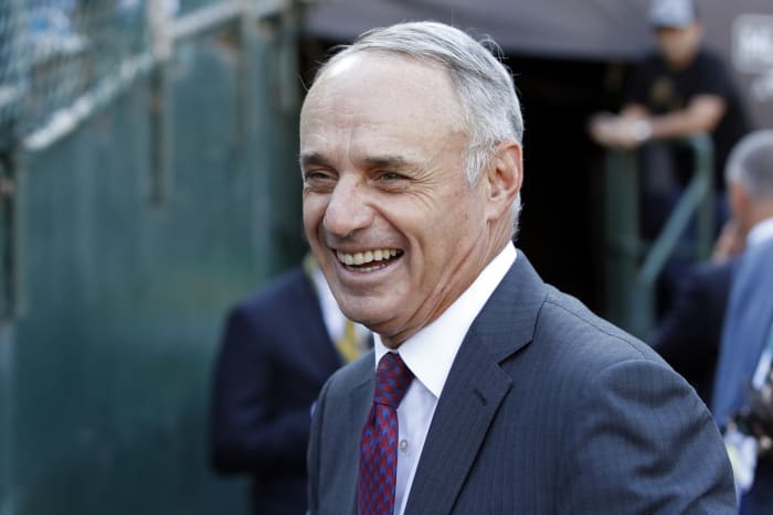 Rob Manfred is the commissioner of MLB, smiling during recent playoff series.
