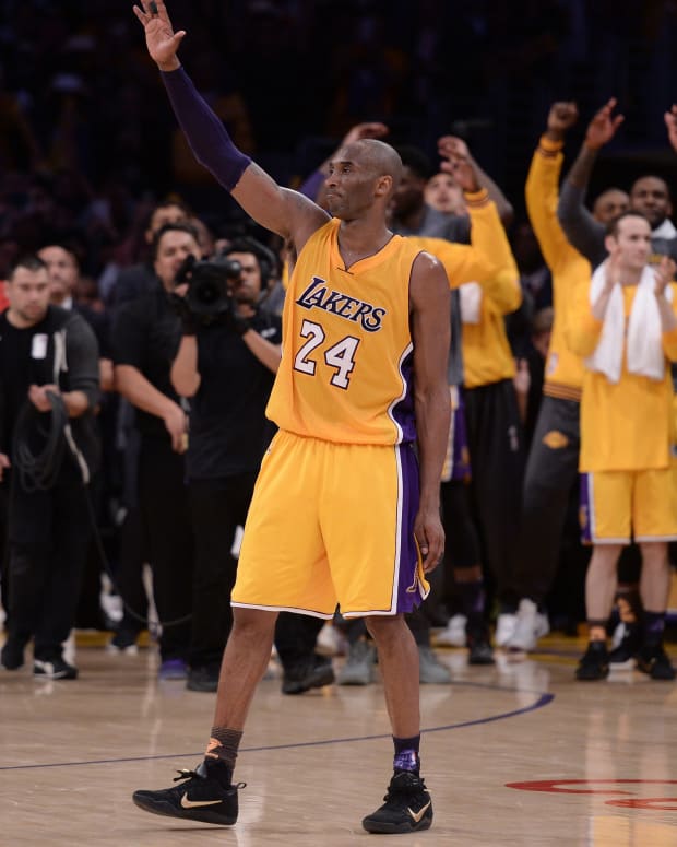 Apr 13, 2016; Los Angeles, CA, USA; Los Angeles Lakers forward Kobe Bryant (24) waves to the Staples Center crowd as he leaves the game against the Utah Jazz in the closing seconds. Bryant scored 60 points in the final game of his career. Mandatory Credit: Robert Hanashiro-USA TODAY Sports
