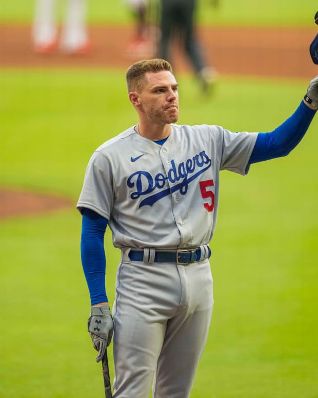 Jun 24, 2022; Cumberland, Georgia, USA; Los Angeles Dodgers first baseman Freddie Freeman (5) acknowledges the fans ovation as he steps to the plate against the Atlanta Braves during the first inning at Truist Park. Mandatory Credit: Dale Zanine-USA TODAY Sports