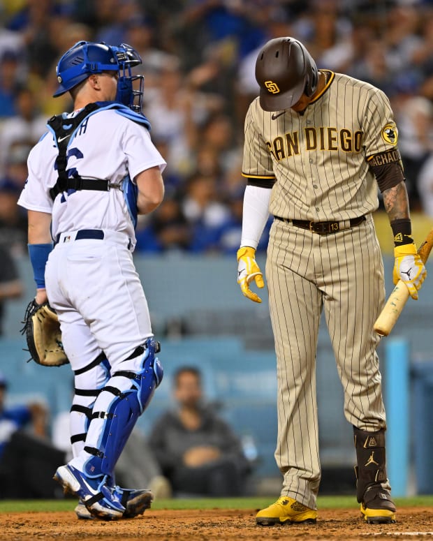 Aug 5, 2022; Los Angeles, California, USA; San Diego Padres third baseman Manny Machado (13) hangs his head after he was called out on strikes in the sixth inning against the Los Angeles Dodgers at Dodger Stadium. Mandatory Credit: Jayne Kamin-Oncea-USA TODAY Sports